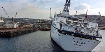 Inside a real-life ghost ship: Extraordinary pictures of massive vessel captured by explorers before it was sent to the scrap heap show luxury boat in an eerie light
