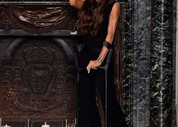 Victoria Beckham doesn’t let crutches or protesters spoil her big moment as she’s supported by (almost) all her family for Paris Fashion Week Show