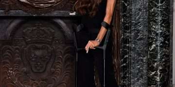 Victoria Beckham doesn’t let crutches or protesters spoil her big moment as she’s supported by (almost) all her family for Paris Fashion Week Show