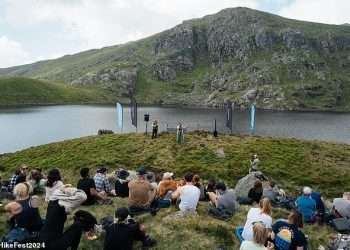 ‘The hills were alive with the sound of music’: Music fans hike up to seven hours to ‘UK’s most remote gig’ – at a reservoir deep in the Snowdonia mountains