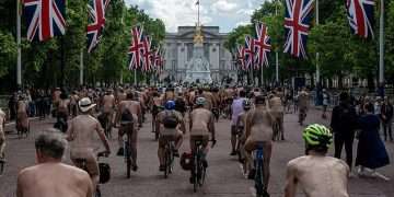 The bare cheek of it! Hundreds of nude cyclists descend upon Buckingham Palace for the 20th World Naked Bike Ride (with only a few wearing helmets)