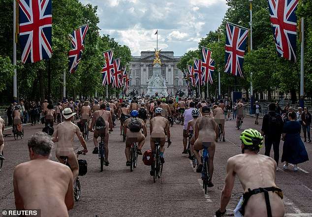 The bare cheek of it! Hundreds of nude cyclists descend upon Buckingham Palace for the 20th World Naked Bike Ride (with only a few wearing helmets)