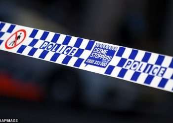 Darkwood death, Coffs Harbour: Woman, 35, charged after man’s body was found in a surfboard bag on the driveway of a rural property