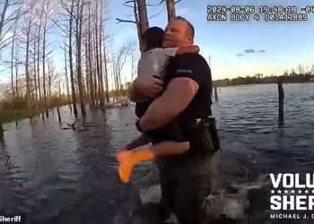 Moment frantic hunt for missing autistic boy, 5, comes to happy ending in Florida pond