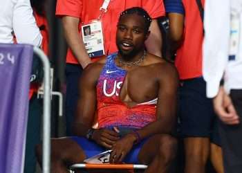 Noah Lyles has COVID but insists he has NO regrets about running 200m – despite needing to be wheeled off the track in Paris