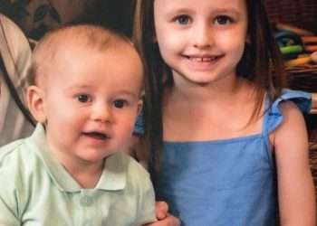 Two children saved from car fire by a quick-thinking hero who smashed the windows with his golf club