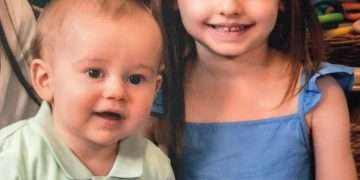 Two children saved from car fire by a quick-thinking hero who smashed the windows with his golf club