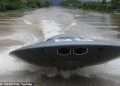 Out of this world! Inventor builds a fully functional flying saucer-inspired jet boat – as incredible footage shows the vehicle reaching 31mph as it skims across the water
