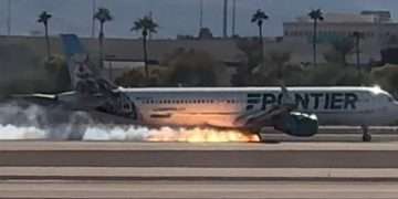Terrifying moment flaming Frontier aircraft lands at major airport