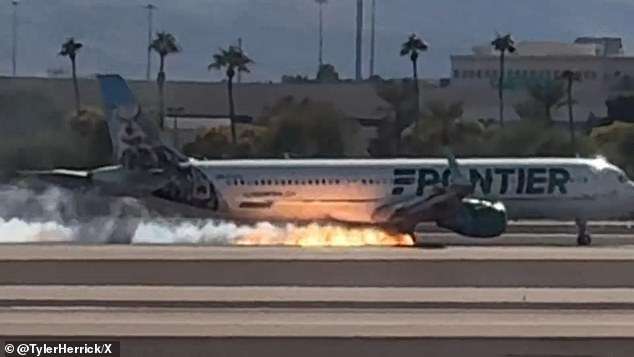 Terrifying moment flaming Frontier aircraft lands at major airport