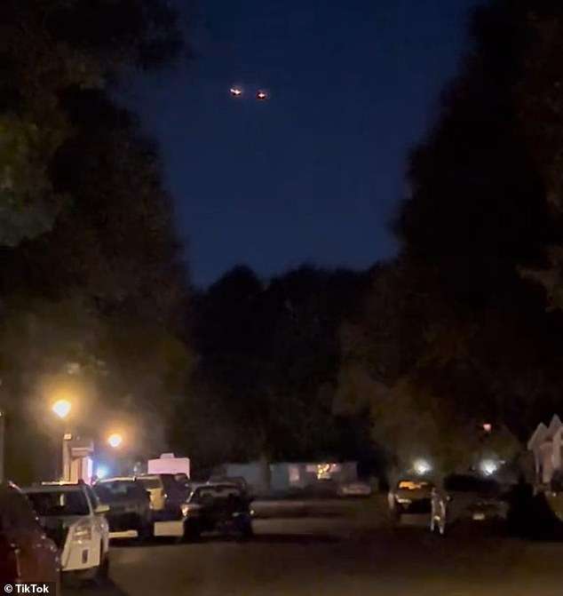 The swarm of UFOs caught on video near US Air Force base by dozens of stunned onlookers