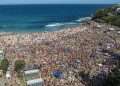 Jaw dropping vision shows thousands of Christmas revellers descend on Bronte beach in Sydney – and locals left to clean up the mess are furious