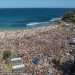 Jaw dropping vision shows thousands of Christmas revellers descend on Bronte beach in Sydney – and locals left to clean up the mess are furious