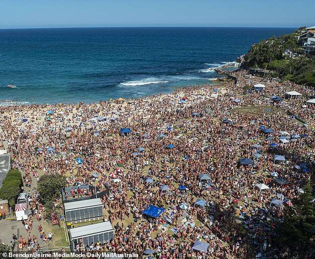 Jaw dropping vision shows thousands of Christmas revellers descend on Bronte beach in Sydney – and locals left to clean up the mess are furious