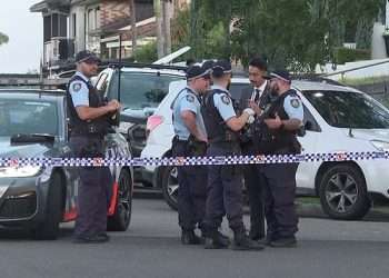 Man is shot dead in a suspected gangland hit in western Sydney – as cops hunt for the gunman and discover a burnt out car nearby