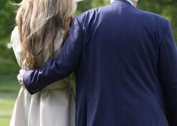 Trump and Melania enjoy VERY rare moment of romance as pair head to Rome for pope’s funeral