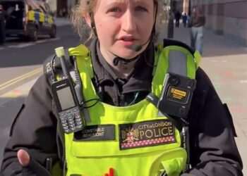 Moment cyclist ticketed for ‘riding no handed’ confronts City of London officer over his fine – but who do YOU think was in the wrong?