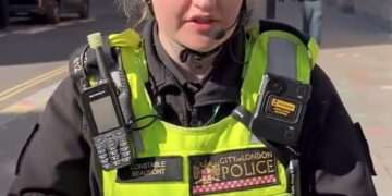 Moment cyclist ticketed for ‘riding no handed’ confronts City of London officer over his fine – but who do YOU think was in the wrong?