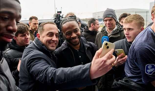 Raheem Sterling touches down in Holland: Former England star mobbed at airport after linking up with Premier League legend in surprise switch after Chelsea nightmare
