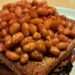 Baked beans will come out of the pot tastier if you stir 1 common ingredient into the sauce
