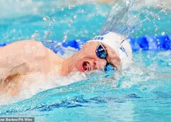 Sean McCann is cheered on by proud parents Kate and Gerry as he swims in Commonwealth 400m freestyle final two decades after older sister Madeleine vanished