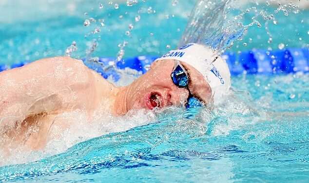 Sean McCann is cheered on by proud parents Kate and Gerry as he swims in Commonwealth 400m freestyle final two decades after older sister Madeleine vanished