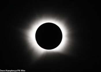Solar eclipse in pictures: Stunning snaps show the moment the moon covered the face of the sun