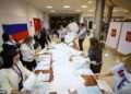 Putin-backing United Russia party is predicted crushing victory with around 50% of the vote in country’s parliamentary elections, exit polls say