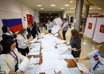 Putin-backing United Russia party is predicted crushing victory with around 50% of the vote in country’s parliamentary elections, exit polls say