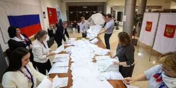 Putin-backing United Russia party is predicted crushing victory with around 50% of the vote in country’s parliamentary elections, exit polls say